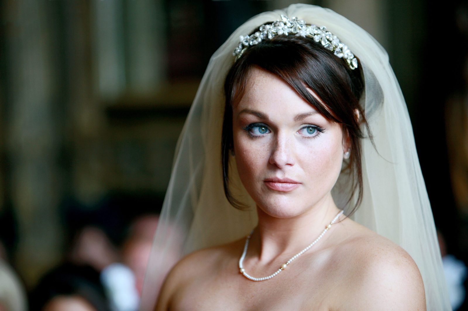 A portrait of a bride in a tiara and veil